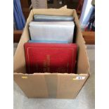 A box containing three albums of Royal related 1st day covers and other 'Royal Commonwealth