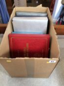 A box containing three albums of Royal related 1st day covers and other 'Royal Commonwealth