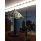 A heavy brass table lamp and a Tiffany style lamp