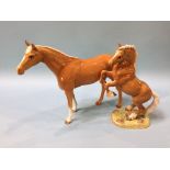 A Beswick model of a rearing horse, number 1014 and another