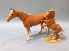 A Beswick model of a rearing horse, number 1014 and another