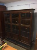 A large barley twist oak three door bookcase