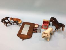 A collection of small Beswick horses, table lighters etc.