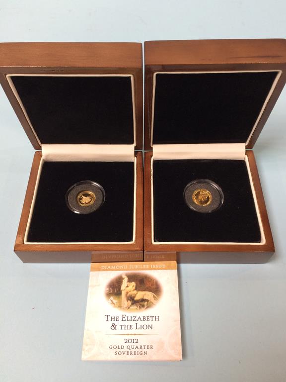 Two boxed quarter sovereigns