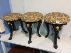 Three cast iron pub stools