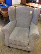 A Wyvern grey easy armchair