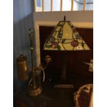 A heavy brass study lamp and a Tiffany style lamp
