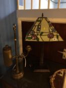 A heavy brass study lamp and a Tiffany style lamp