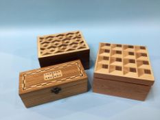 Two small parquetry topped boxes and a set of dominos