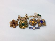 A collection of vintage costume jewellery brooches