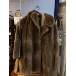 A leather and sheep wool jacket, size 38, and a Maurice Velody fur coat