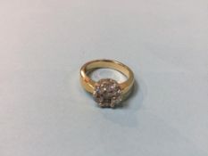 A '14k' diamond cluster ring, size 'N', 6g