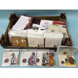 A large quantity of packaged Royal Mint coins, £5s etc.