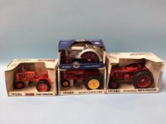 Four ERTL Die Cast model tractors