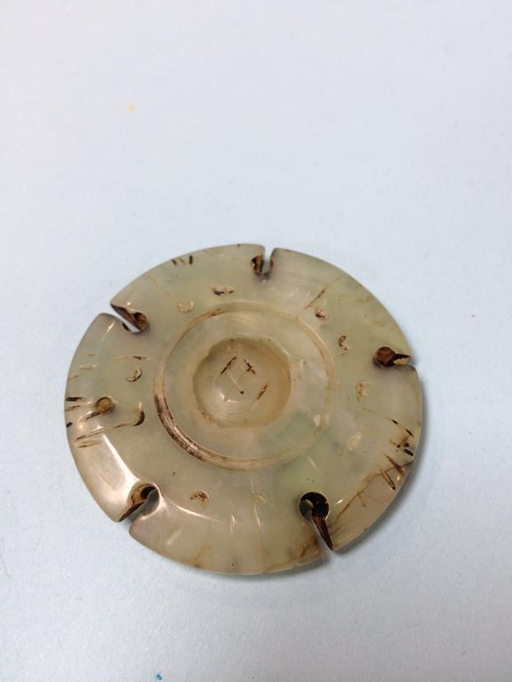 An Oriental Jade pendant, 25.7g, 50.5mm approx. diameter - Image 2 of 2