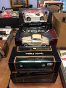 Seven boxed Die Cast cars