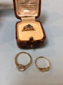 An 18ct gold ring, 2.4g and two 9ct gold rings, 3.5g