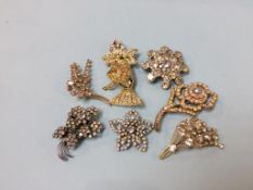 A collection of vintage costume brooches