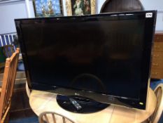 An LG TV, with remote