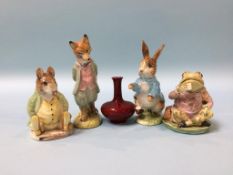 A miniature Royal Doulton Flambe vase, 6cm height and four Beswick Beatrix Potter figures
