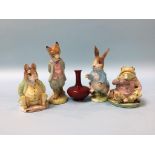 A miniature Royal Doulton Flambe vase, 6cm height and four Beswick Beatrix Potter figures