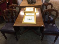 A mahogany dining table and four chairs