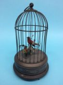 An Edwardian clockwork bird cage automation