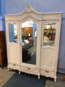 A painted three door French armoire