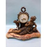 A French clock group, enamelled dial, with eight day movement, having winged angels and a