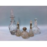 Three glass silver topped scent bottles and two decanters