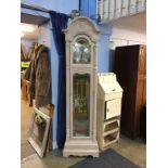 A Howard Miller modern eight day long case clock, (cost £1600), in a pale oak case