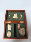 A collection of various pendants, mother of pearl etc.