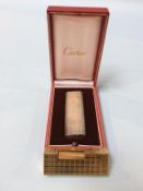 A boxed Cartier lighter, together with a gold plated Dunhill lighter