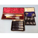 A cased set of silver spoons etc.