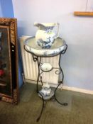 A metalwork stand to include a blue and white wash set