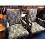 A pair of Edwardian oak armchairs