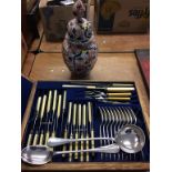 A canteen of cutlery and an Imari vase