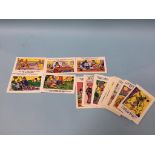 A collection of 'Saucy' postcards, 59 cards