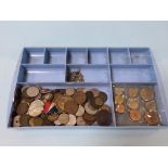 A tray of assorted loose coins