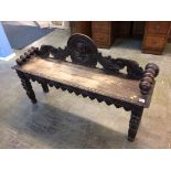 A carved oak bench