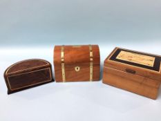 Three modern wood caskets