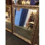 A large silver framed mirror, 133cm x 102cm