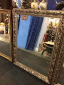 A large silver framed mirror, 133cm x 102cm