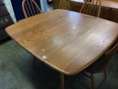 An Ercol Golden Dawn drop leaf table