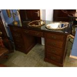An Edwardian mahogany pedestal desk, with inset leather top