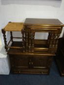 An oak nest of tables, a stool and two other cabinets