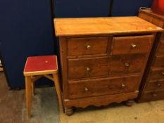 A pine chest of drawers