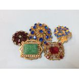 A collection of vintage costume jewellery brooches