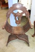 A Moorish/Middle Eastern 'X' framed chair, inset with mother of pearl