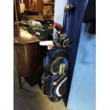 A golf trolley, Dunlop golf clubs etc.